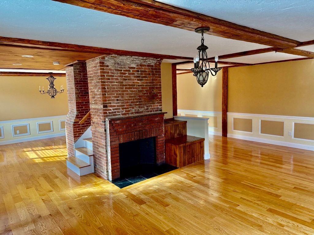 Empty room, Fireplace, Interior, Pendant Lights, Stone Walls, Wooden Beams, Wood Texture Flooring