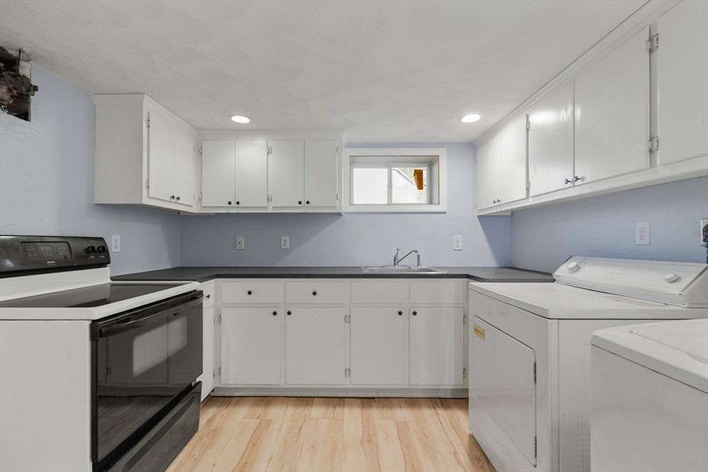 Interior, Kitchen, Recessed Lighting, Washer, Wood Texture Flooring