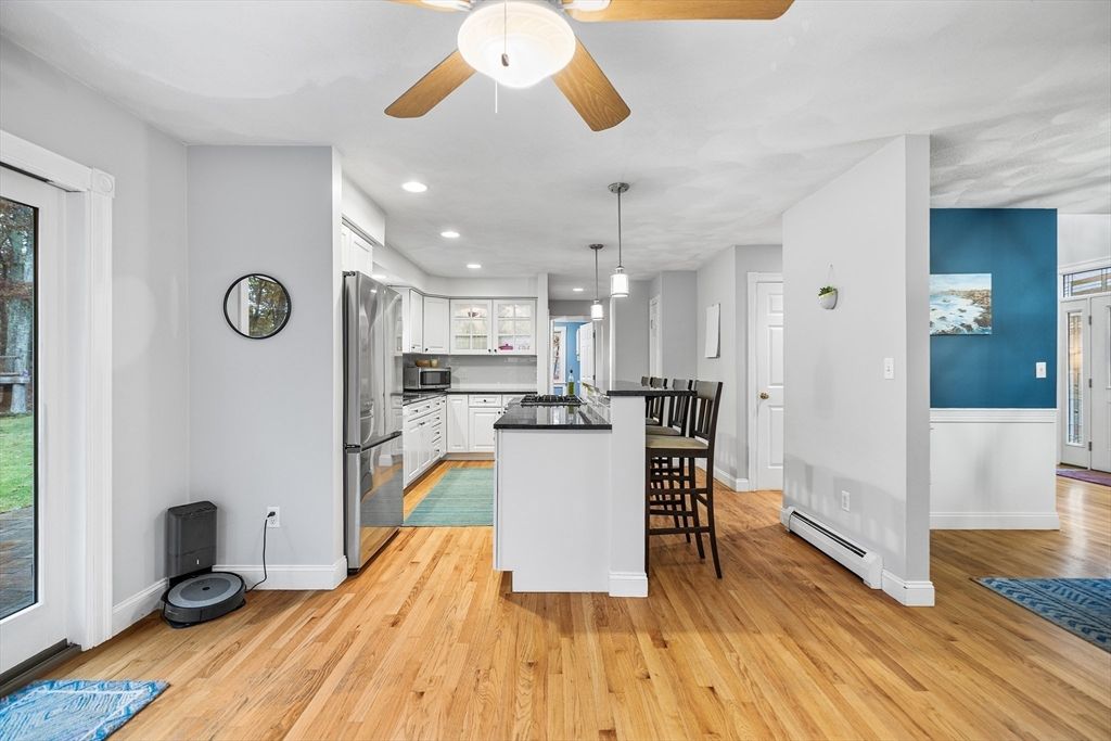 Dining room, Interior, Kitchen, Pendant Lights, Recessed Lighting, Stainless Steel Appliances, Wood Texture Flooring