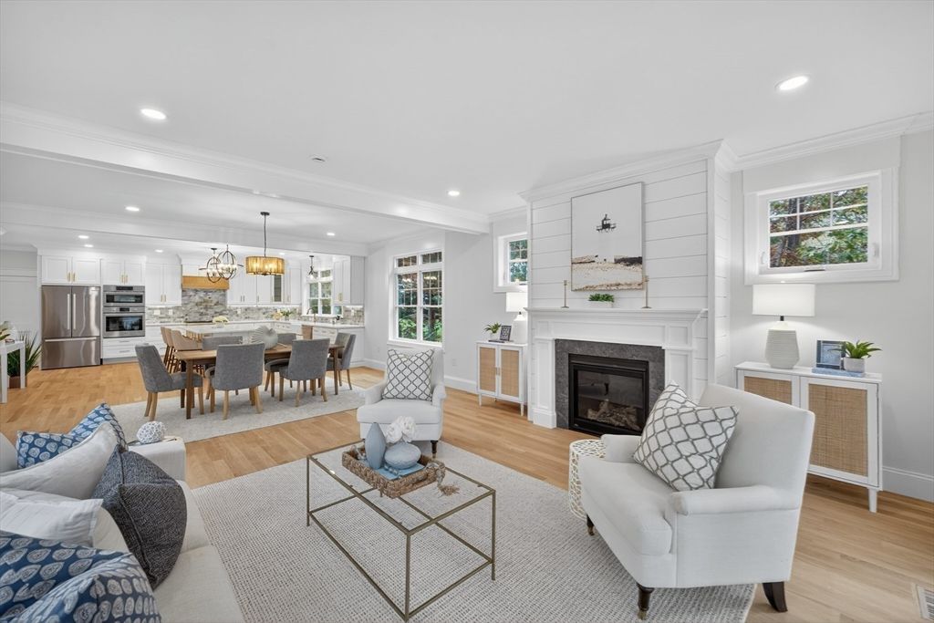 Chandelier, Dining room, Fireplace, Interior, Kitchen, Living room, Pendant Lights, Recessed Lighting, Stainless Steel Appliances, Wood Texture Flooring