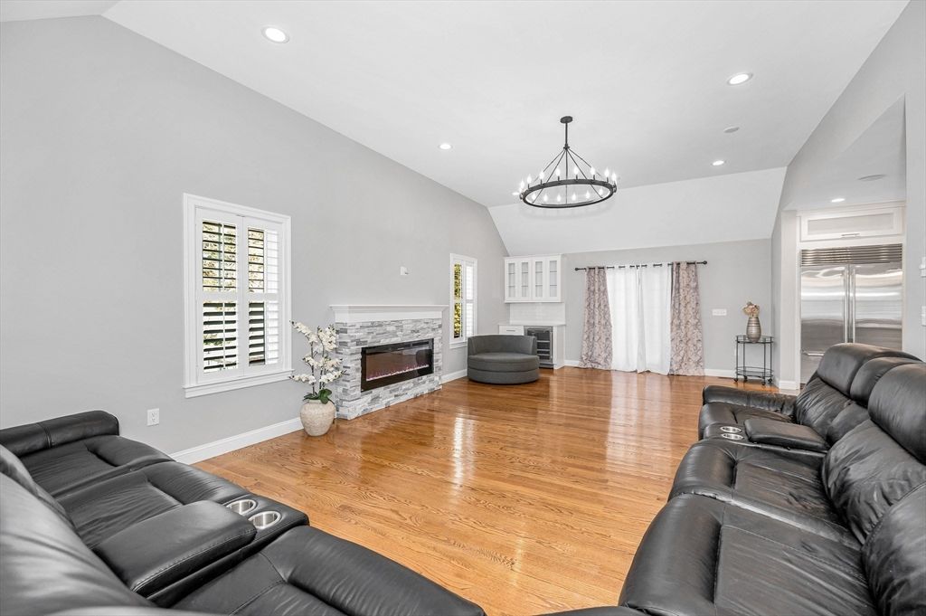 Chandelier, Home Theatre Room, Fireplace, Interior, Living room, Recessed Lighting, Stainless Steel Appliances, Wood Texture Flooring