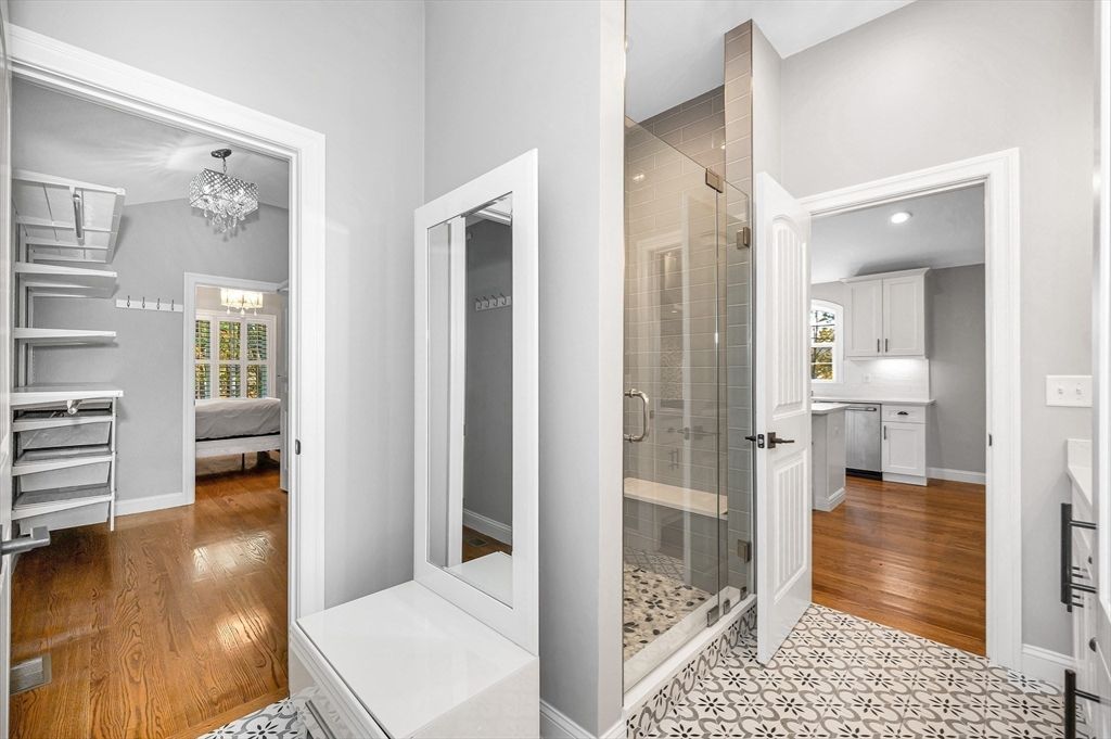 Bathroom, Chandelier, Glass Shower, Interior, Recessed Lighting, Wood Texture Flooring