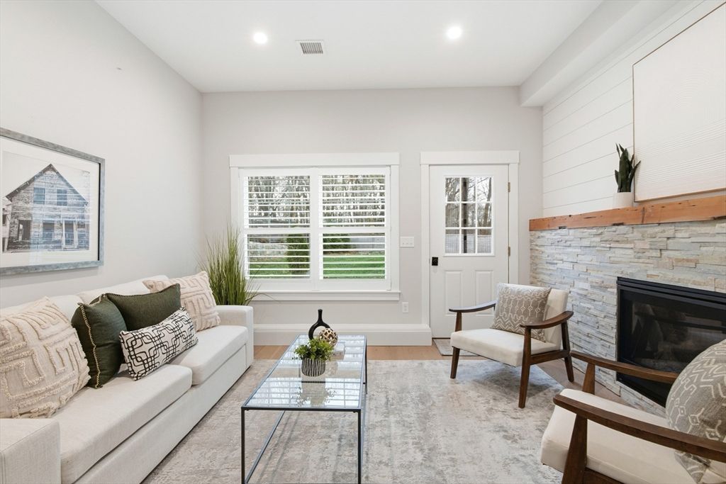 Fireplace, Interior, Living room, Recessed Lighting, Stone Walls, Wood Texture Flooring