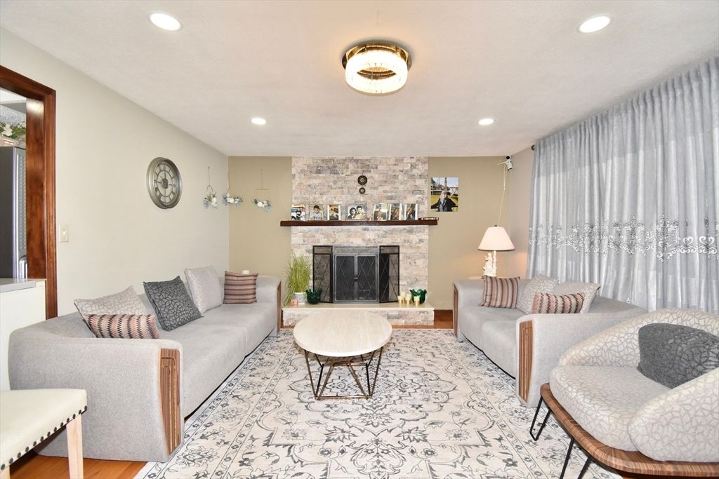 Fireplace, Interior, Living room, Recessed Lighting, Stone Walls, Wood Texture Flooring