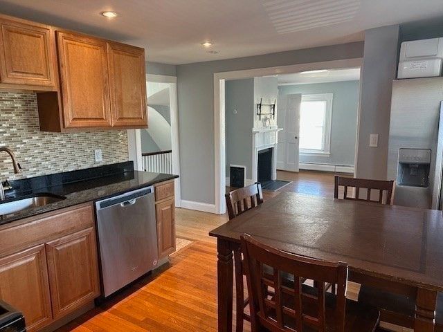 Dining room, Fireplace, Interior, Kitchen, Recessed Lighting, Wood Texture Flooring