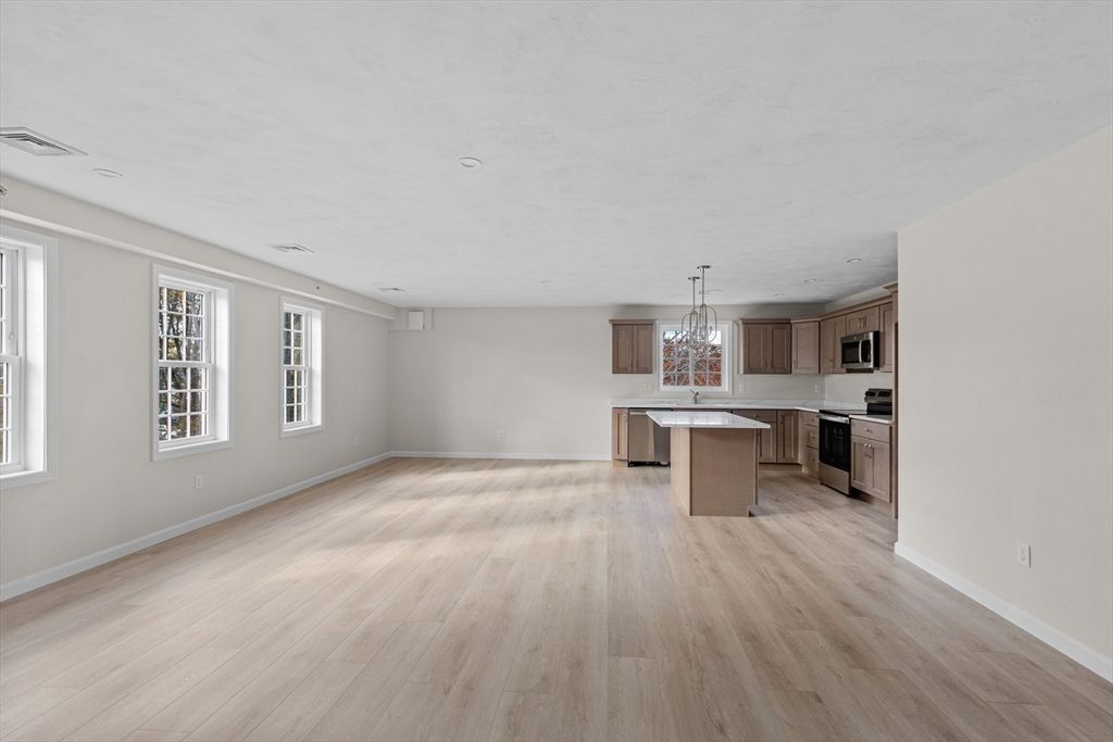 Chandelier, Empty room, Interior, Kitchen, Recessed Lighting, Stainless Steel Appliances, Wood Texture Flooring
