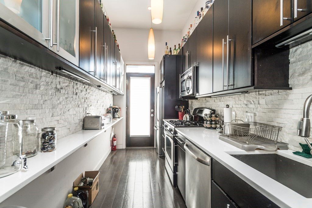 Interior, Kitchen, Pendant Lights, Stainless Steel Appliances, Stone Walls, Wood Texture Flooring