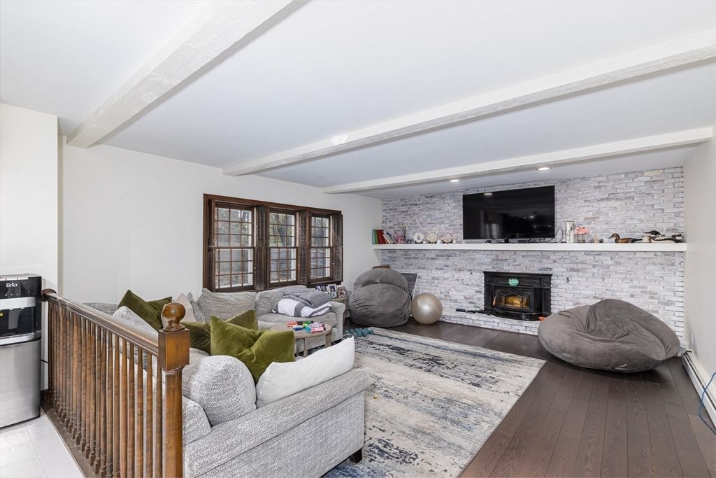 Fireplace, Interior, Living room, Recessed Lighting, Stone Walls, Wood Texture Flooring