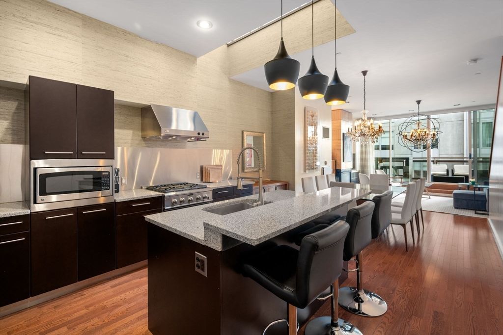 Chandelier, Dining room, Interior, Kitchen, Pendant Lights, Recessed Lighting, Stainless Steel Appliances, Wood Texture Flooring