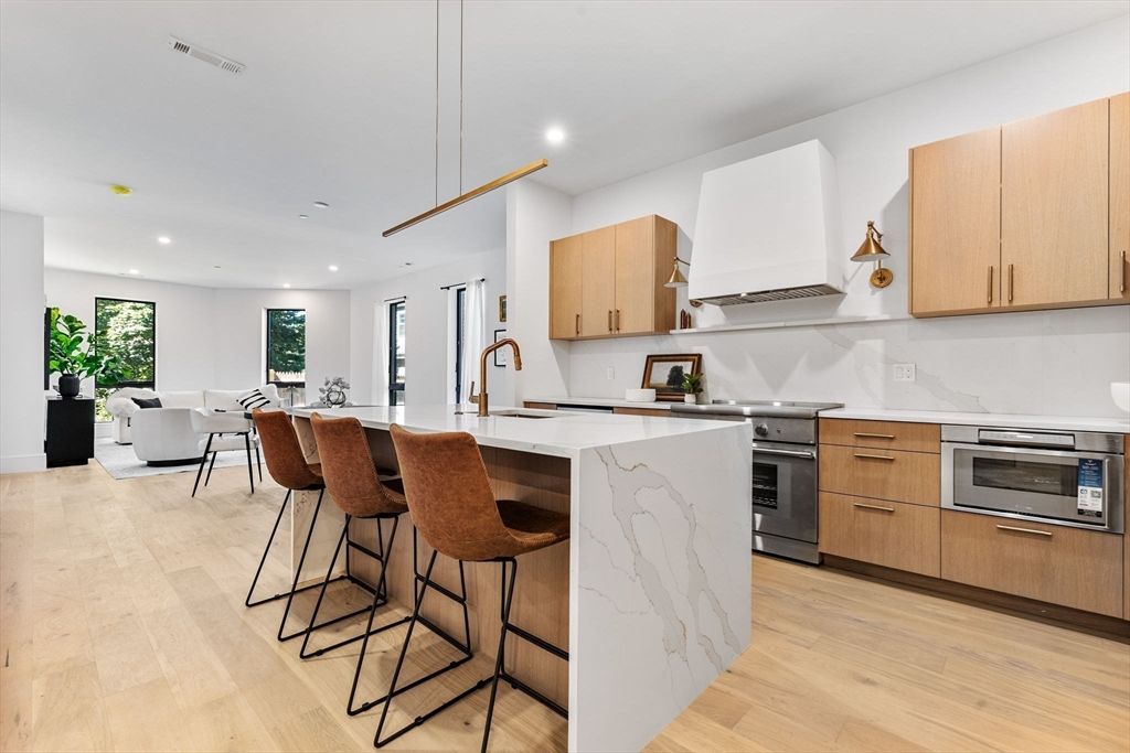 Dining room, Interior, Kitchen, Living room, Pendant Lights, Recessed Lighting, Stainless Steel Appliances, Wood Texture Flooring