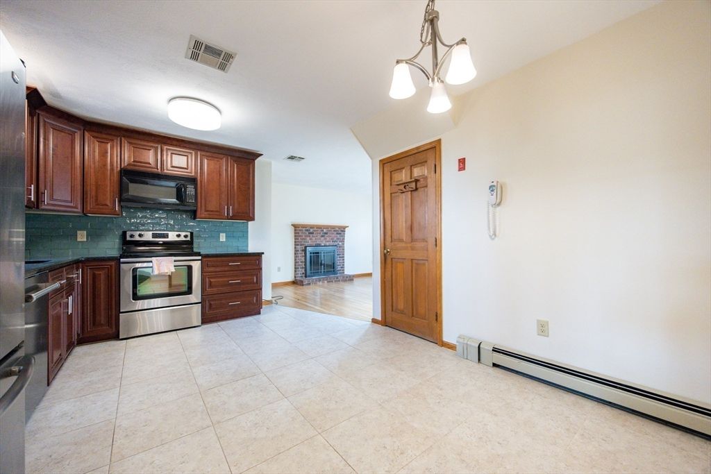 Fireplace, Interior, Kitchen, Pendant Lights, Stainless Steel Appliances, Wood Texture Flooring