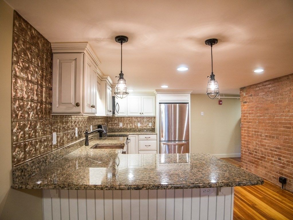 Interior, Kitchen, Pendant Lights, Recessed Lighting, Stainless Steel Appliances, Stone Walls, Wood Texture Flooring