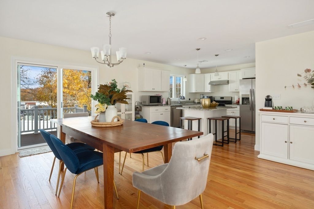 Chandelier, Dining room, Interior, Kitchen, Pendant Lights, Recessed Lighting, Stainless Steel Appliances, Wood Texture Flooring