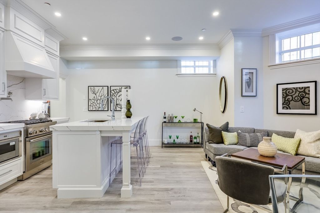 Interior, Kitchen, Marble Walls, Recessed Lighting, Stainless Steel Appliances, Wood Texture Flooring