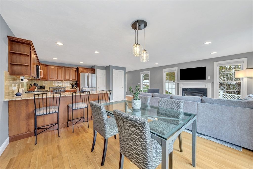 Dining room, Fireplace, Interior, Kitchen, Living room, Pendant Lights, Recessed Lighting, Stainless Steel Appliances, Wood Texture Flooring