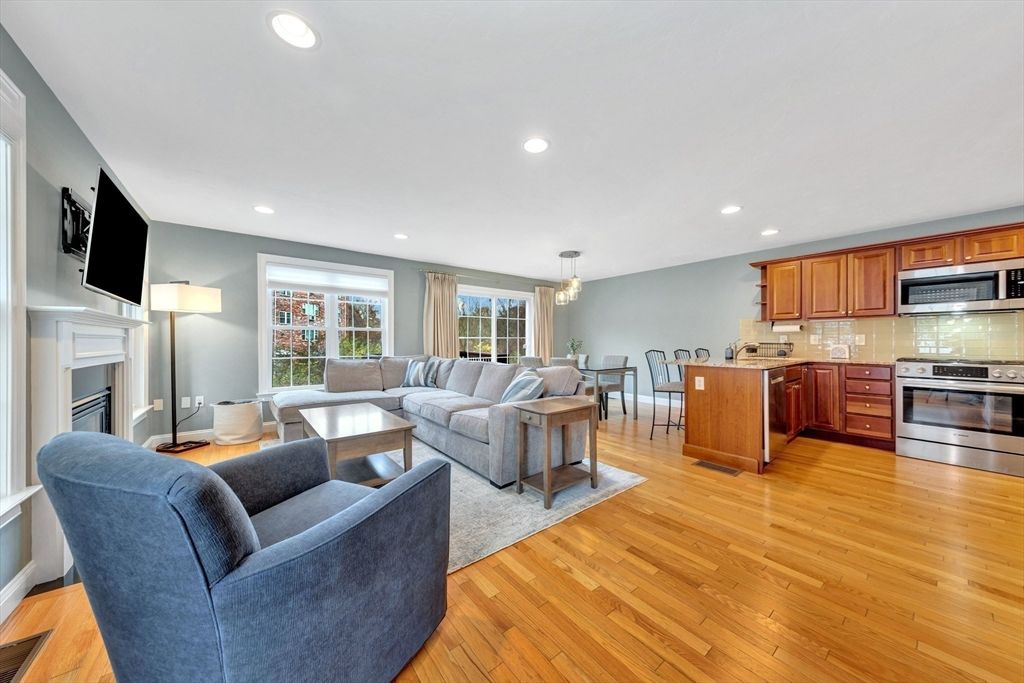 Dining room, Fireplace, Interior, Kitchen, Living room, Pendant Lights, Recessed Lighting, Stainless Steel Appliances, Wood Texture Flooring