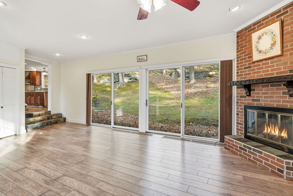Empty room, Fireplace, Interior, Recessed Lighting, Stone Walls, Wood Texture Flooring