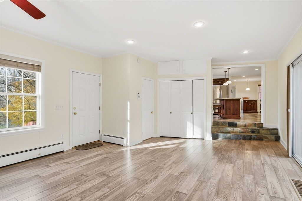 Empty room, Interior, Kitchen, Pendant Lights, Recessed Lighting, Stainless Steel Appliances, Wood Texture Flooring