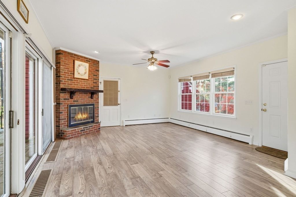 Empty room, Fireplace, Interior, Recessed Lighting, Stone Walls, Wood Texture Flooring