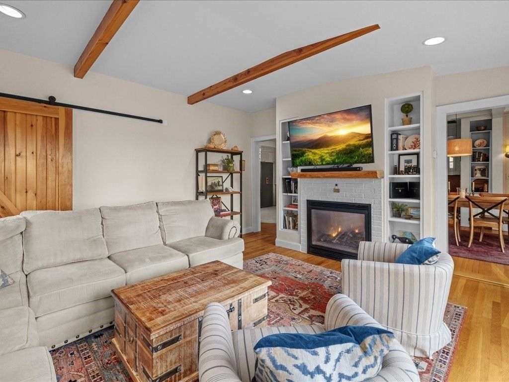 Dining room, Fireplace, Interior, Living room, Recessed Lighting, Wooden Beams, Wood Texture Flooring