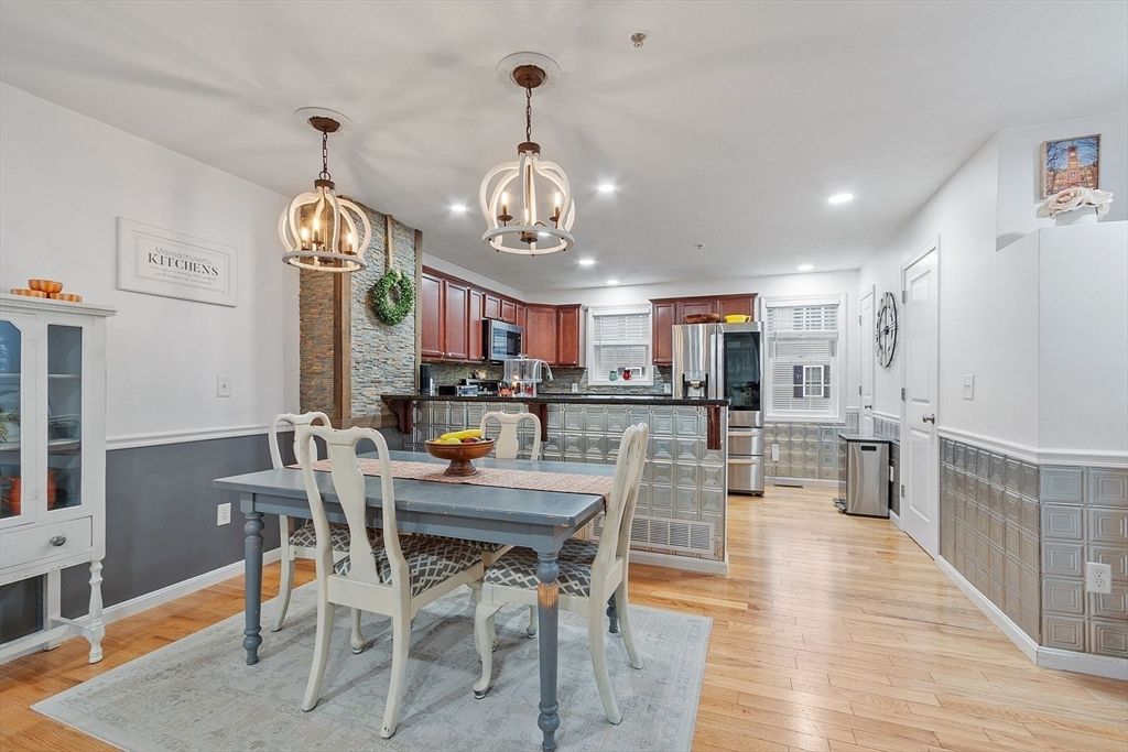 Dining room, Interior, Kitchen, Pendant Lights, Recessed Lighting, Stainless Steel Appliances, Wood Texture Flooring