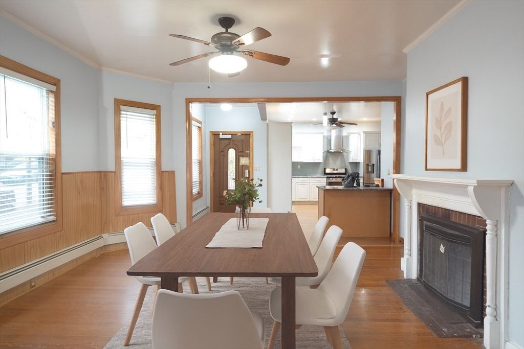 Dining room, Fireplace, Interior, Kitchen, Recessed Lighting, Stainless Steel Appliances, Wood Texture Flooring