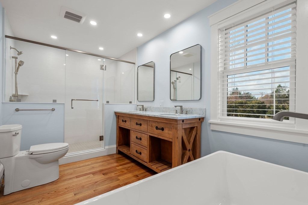 Bathroom, Dual Sink Vanities, Glass Shower, Interior, Recessed Lighting, Wood Texture Flooring