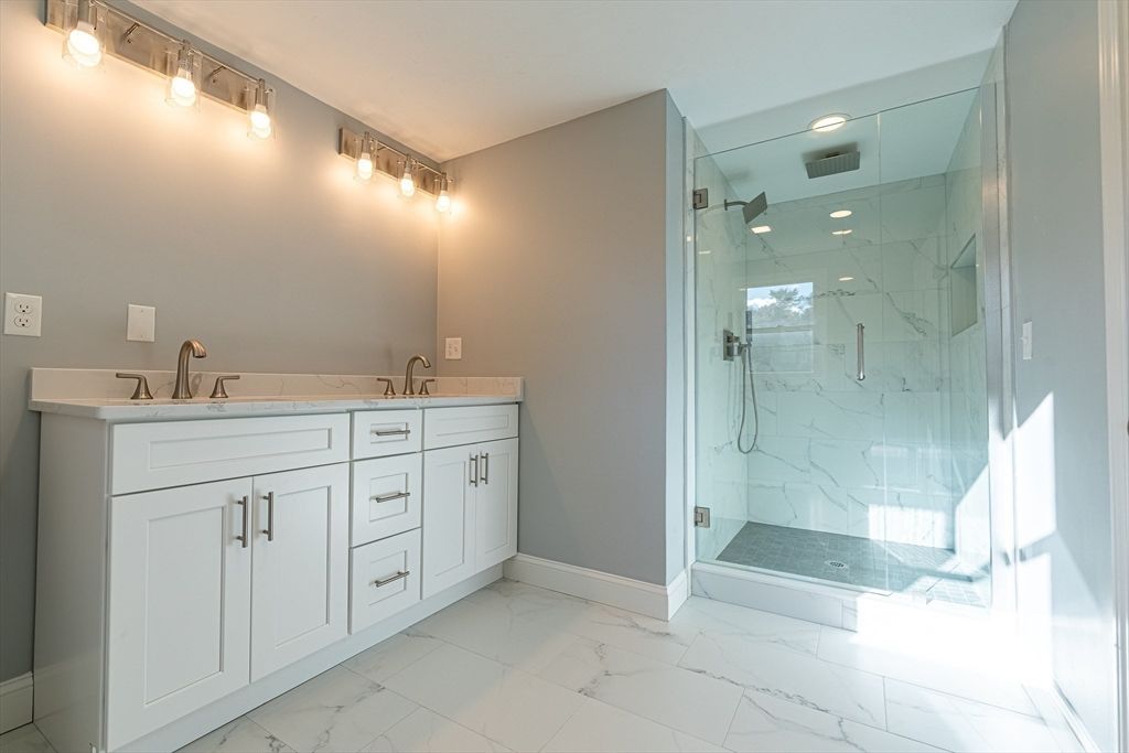 Bathroom, Dual Sink Vanities, Glass Shower, Interior, Marble, Marble Walls, Recessed Lighting