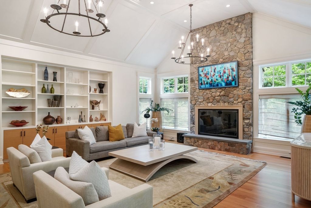 Chandelier, Fireplace, Interior, Living room, Recessed Lighting, Stone Walls, Wood Texture Flooring