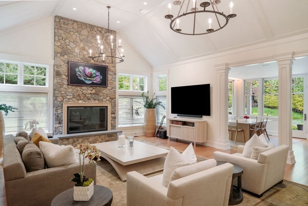 Chandelier, Dining room, Fireplace, Interior, Living room, Recessed Lighting, Stone Walls, Wood Texture Flooring