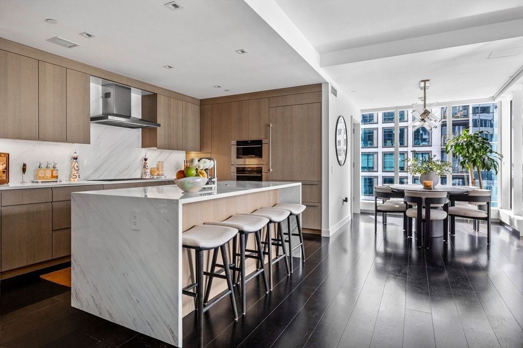 Dining room, Interior, Kitchen, Marble Walls, Recessed Lighting, Stainless Steel Appliances, Wood Texture Flooring