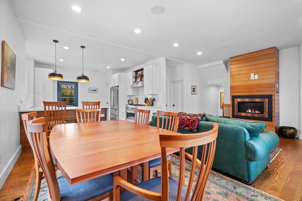 Dining room, Fireplace, Interior, Kitchen, Living room, Pendant Lights, Recessed Lighting, Stainless Steel Appliances, Wood Texture Flooring, Wooden Walls