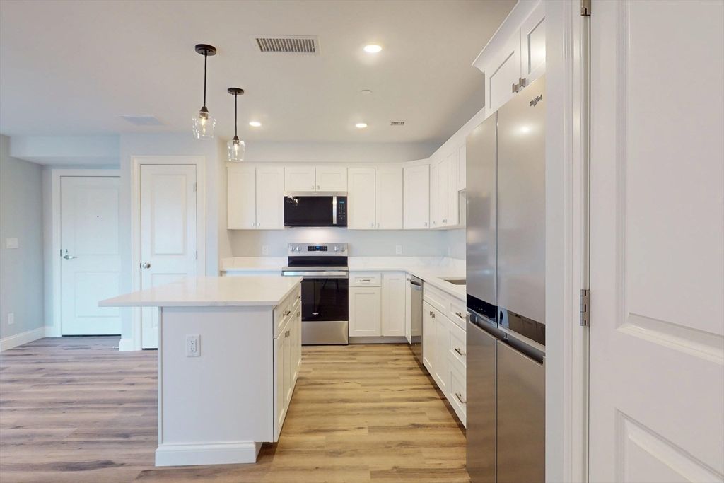 Interior, Kitchen, Pendant Lights, Recessed Lighting, Stainless Steel Appliances, Wood Texture Flooring