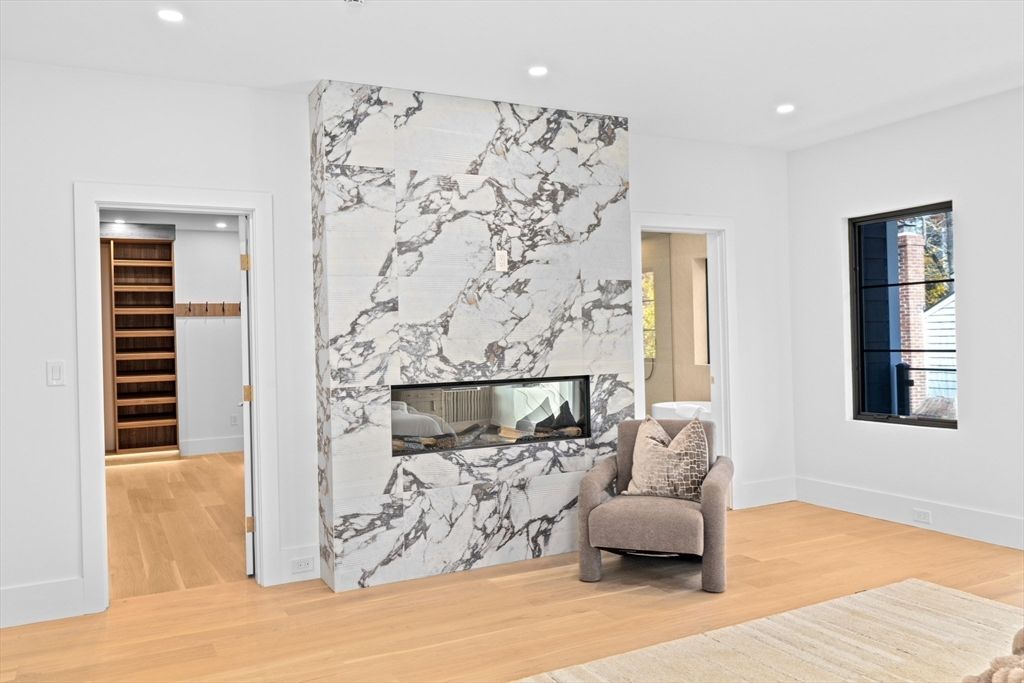 Fireplace, Interior, Marble Walls, Recessed Lighting, Wood Texture Flooring