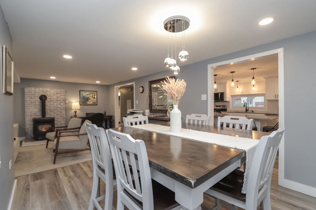 Dining room, Fireplace, Interior, Living room, Pendant Lights, Recessed Lighting, Stone Walls, Wood Texture Flooring