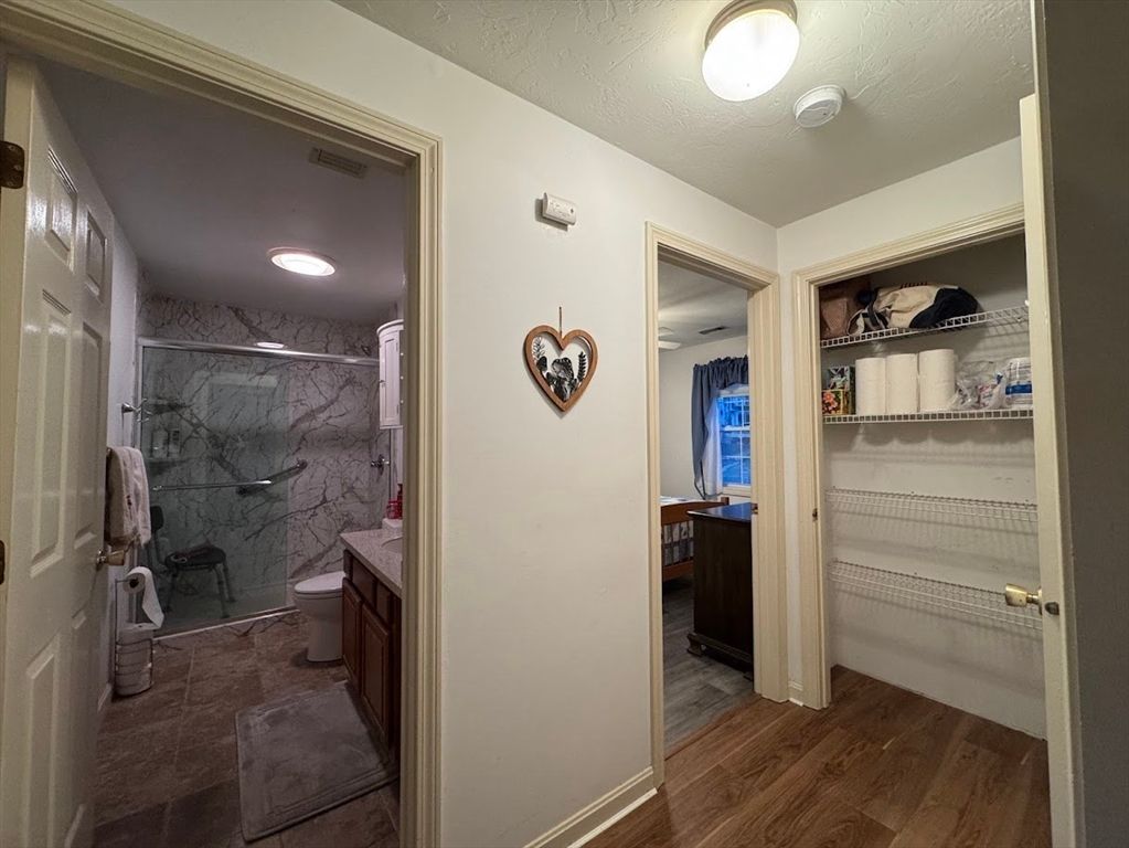 Bathroom, Glass Shower, Interior, Marble Walls, Recessed Lighting, Wood Texture Flooring