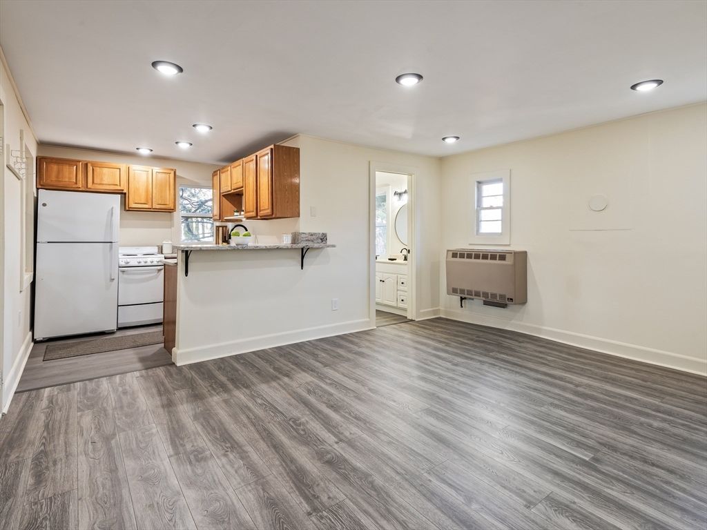 Interior, Kitchen, Recessed Lighting, Washer, Wood Texture Flooring