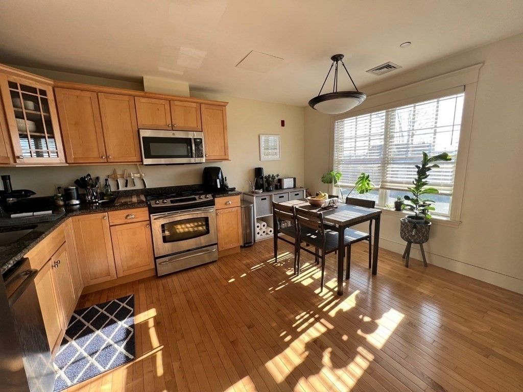 Dining room, Interior, Kitchen, Pendant Lights, Recessed Lighting, Stainless Steel Appliances, Wood Texture Flooring