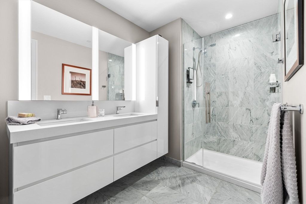 Bathroom, Dual Sink Vanities, Glass Shower, Interior, Marble, Marble Walls, Recessed Lighting