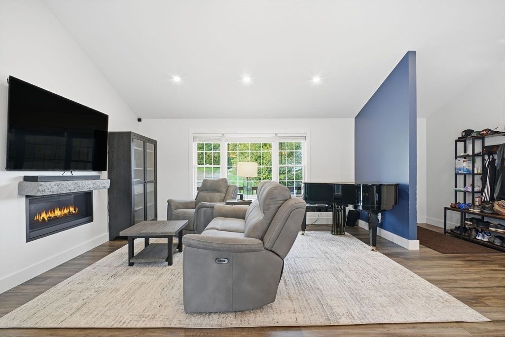 Fireplace, Interior, Living room, Piano, Recessed Lighting, Wood Texture Flooring