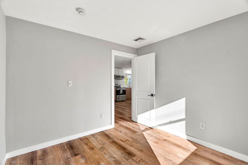 Empty room, Interior, Kitchen, Stainless Steel Appliances, Wood Texture Flooring