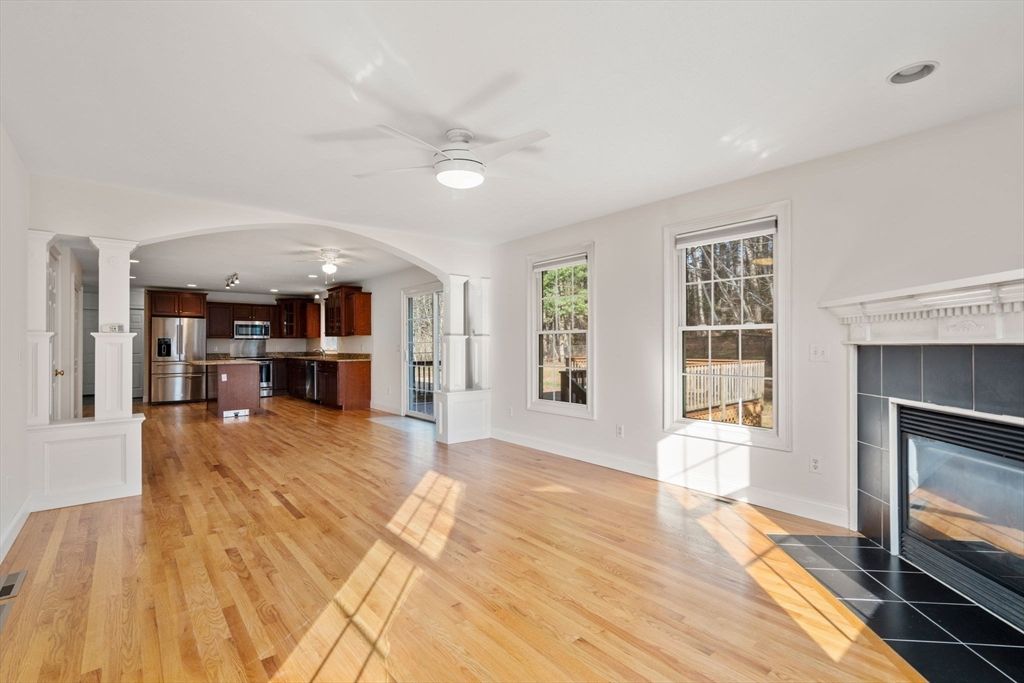 Empty room, Fireplace, Interior, Kitchen, Stainless Steel Appliances, Wood Texture Flooring