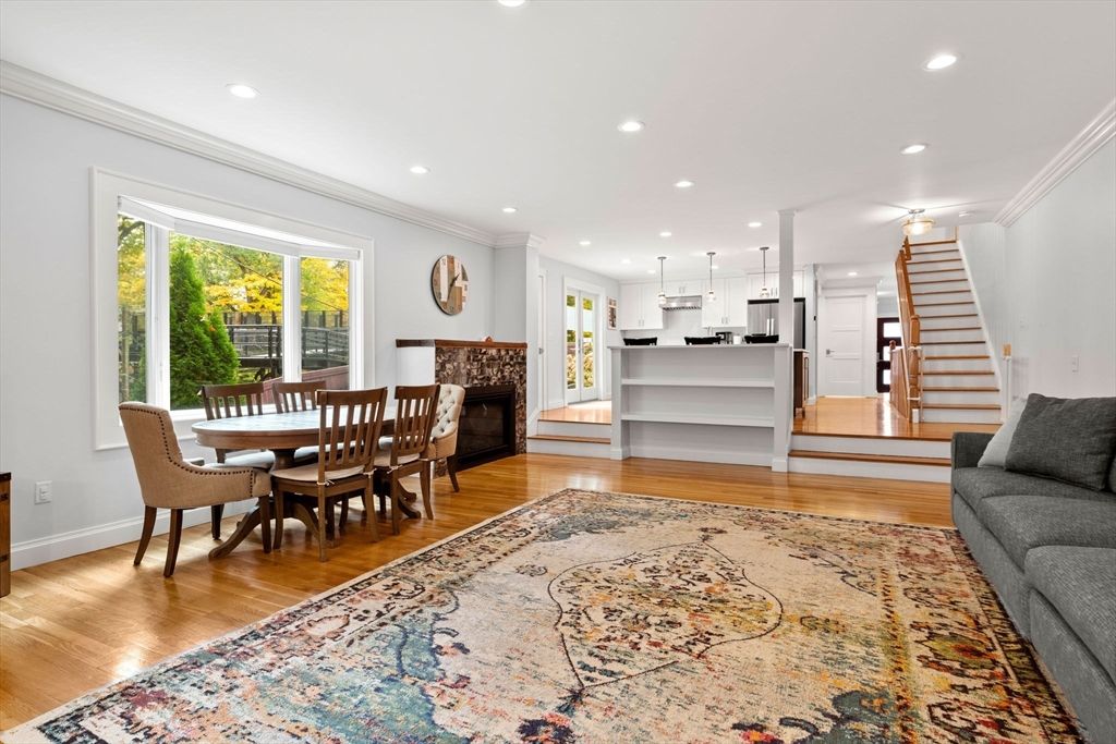 Dining room, Fireplace, Interior, Kitchen, Pendant Lights, Recessed Lighting, Stainless Steel Appliances, Wood Texture Flooring