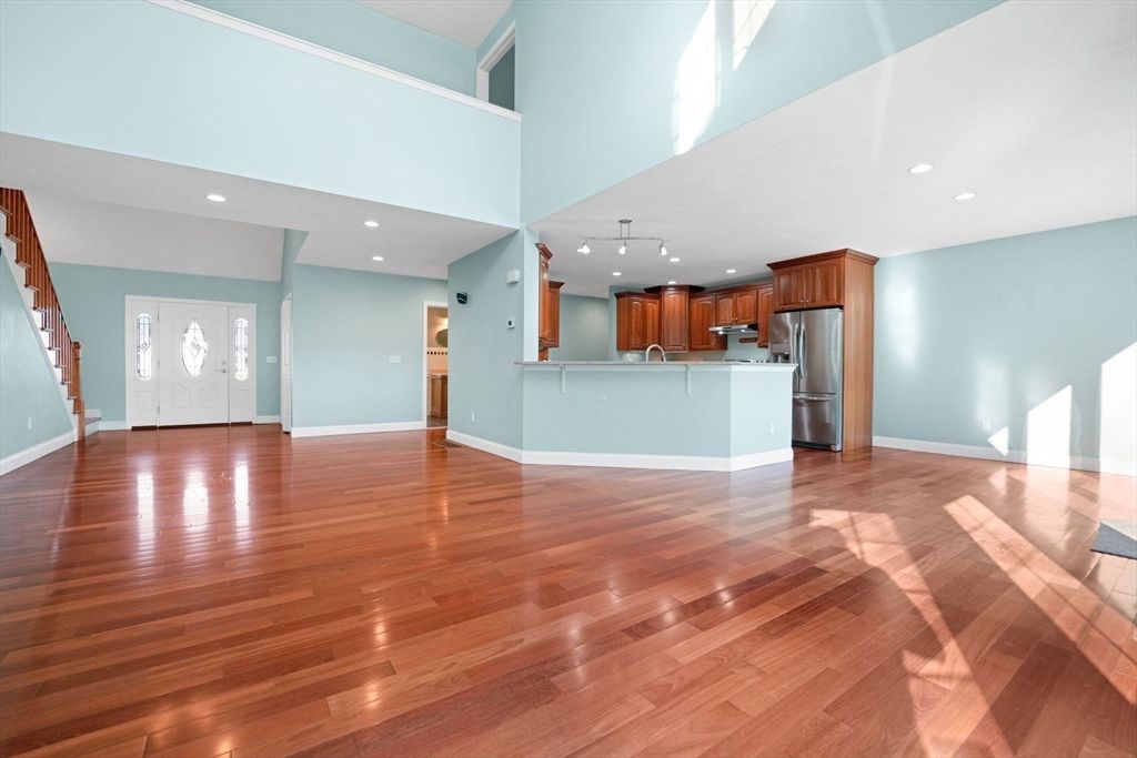 Empty room, Interior, Kitchen, Recessed Lighting, Stainless Steel Appliances, Wood Texture Flooring