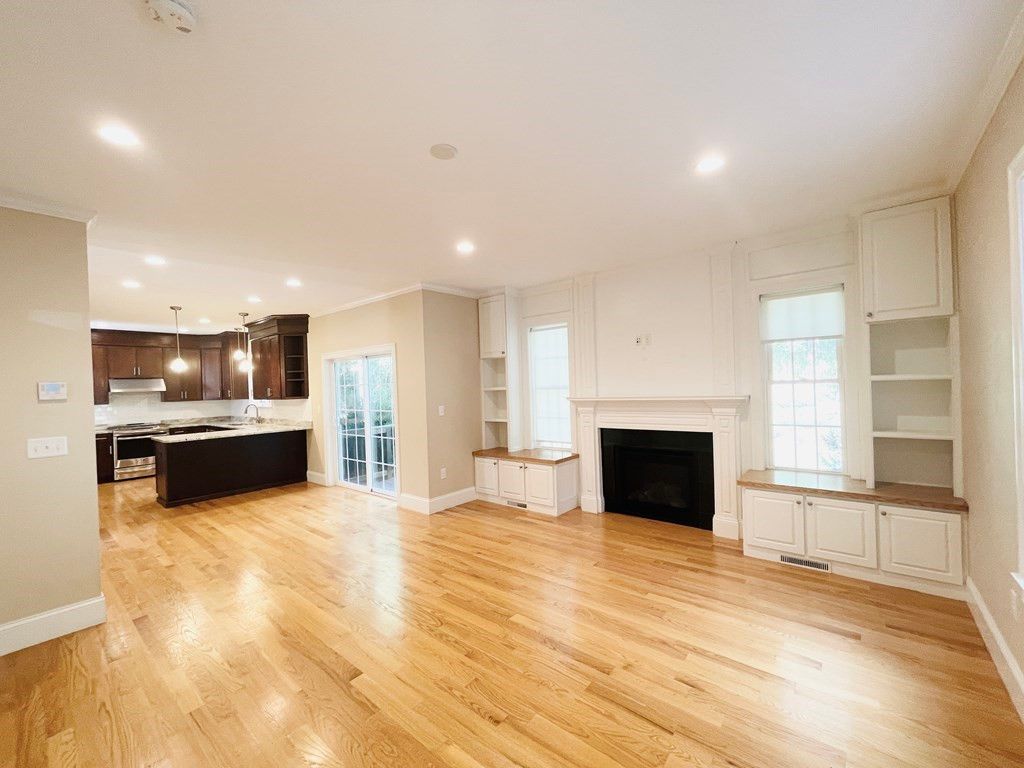 Empty room, Fireplace, Interior, Kitchen, Pendant Lights, Recessed Lighting, Wood Texture Flooring