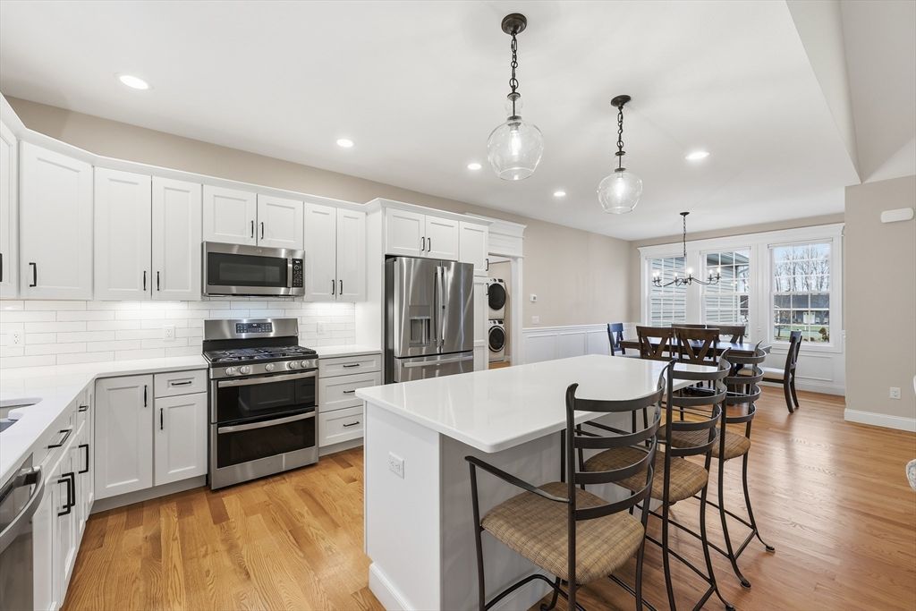 Dining room, Interior, Kitchen, Pendant Lights, Recessed Lighting, Stainless Steel Appliances, Wood Texture Flooring