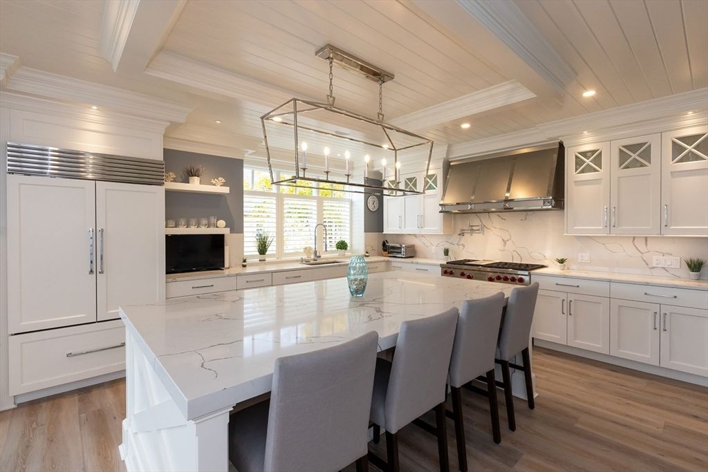 Interior, Kitchen, Marble Walls, Pendant Lights, Recessed Lighting, Stainless Steel Appliances, Wood Texture Flooring