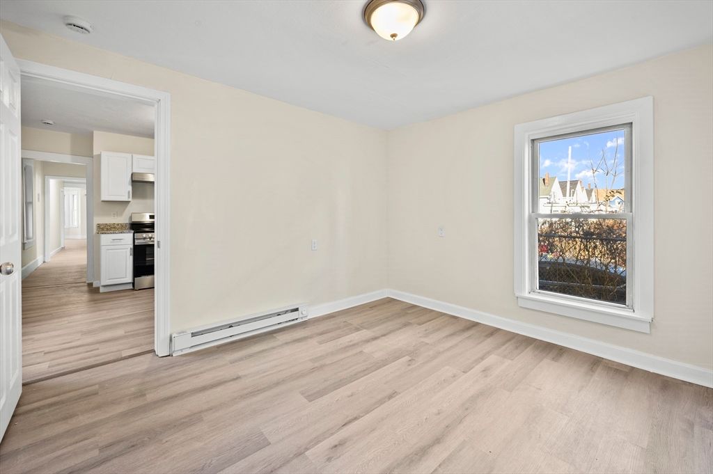 Empty room, Interior, Kitchen, Stainless Steel Appliances, Wood Texture Flooring