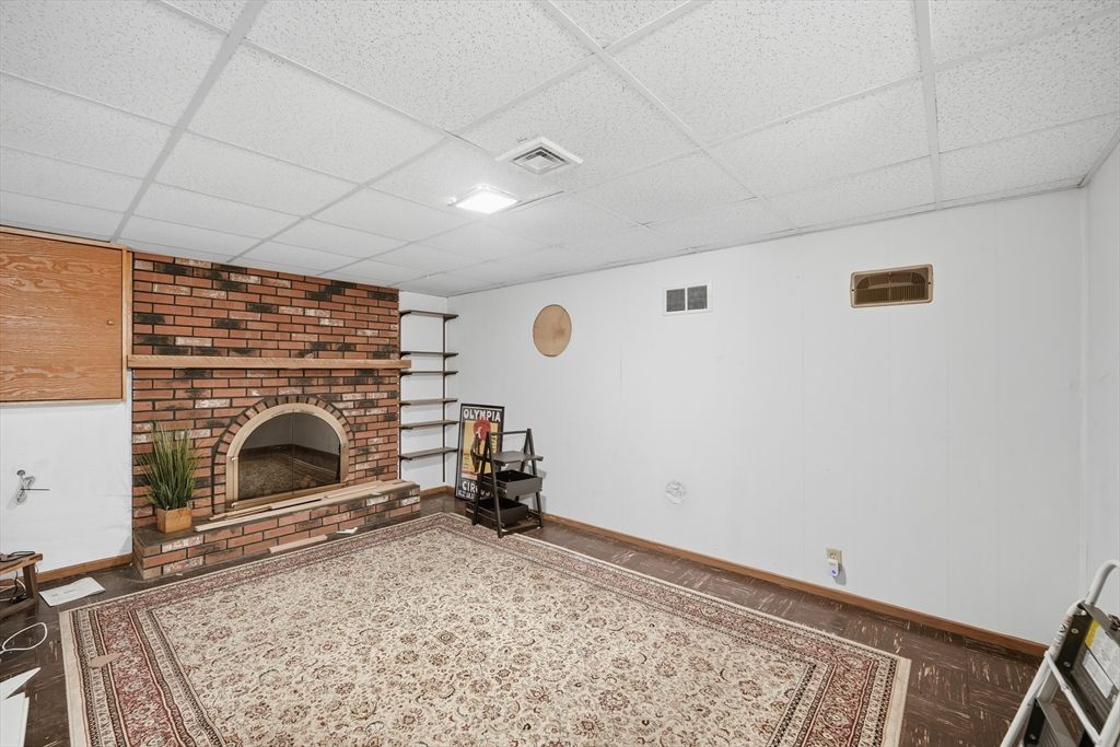 Empty room, Fireplace, Interior, Recessed Lighting, Stone Walls, Wood Texture Flooring