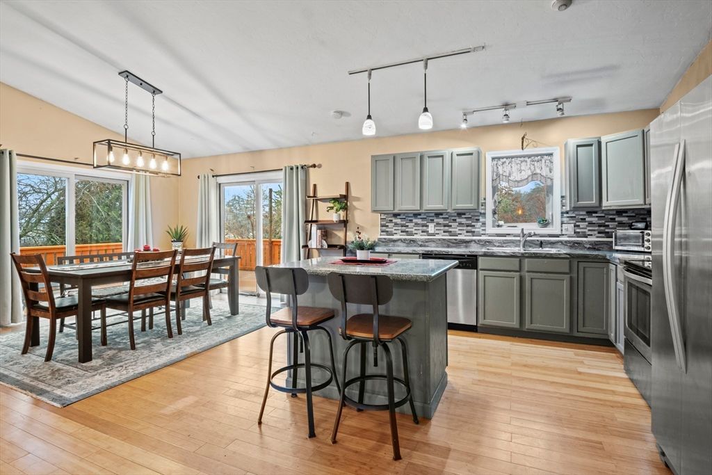 Dining room, Interior, Kitchen, Pendant Lights, Stainless Steel Appliances, Wood Texture Flooring
